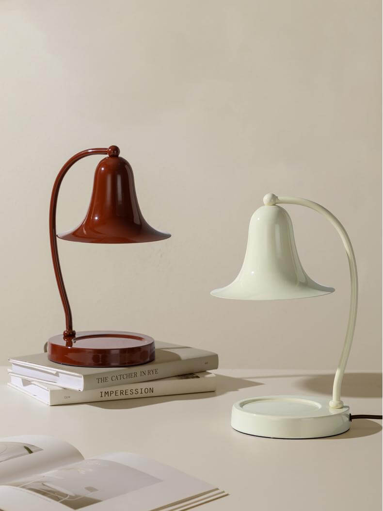 Dual-tone scented wax warmer lamp setup with stylish bell designs, enhancing ambiance and fragrance at home.
