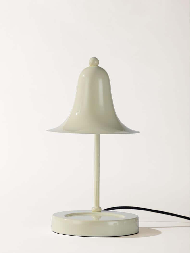 Elegant scented wax warmer lamp in soft green, illuminating your space while enhancing aromatic flavors.