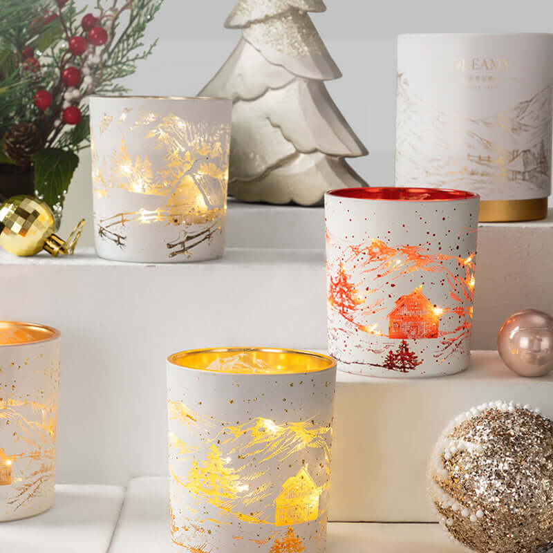 Lumishade candles glowing in a festive setting with holiday decorations and shimmering ornaments.