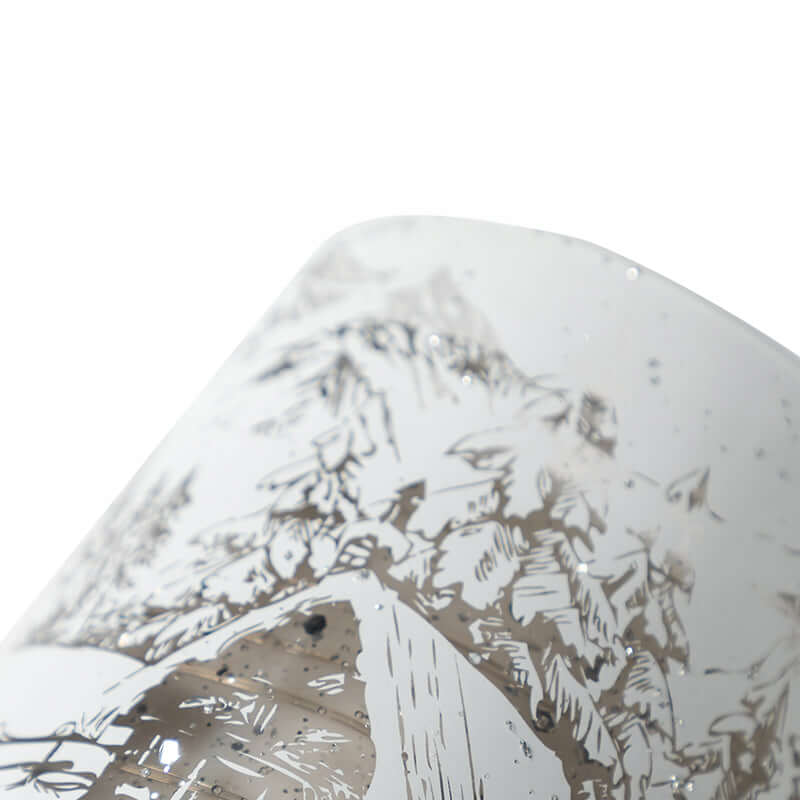 Close-up of the Lumishade Candle showcasing its intricate winter landscape design.