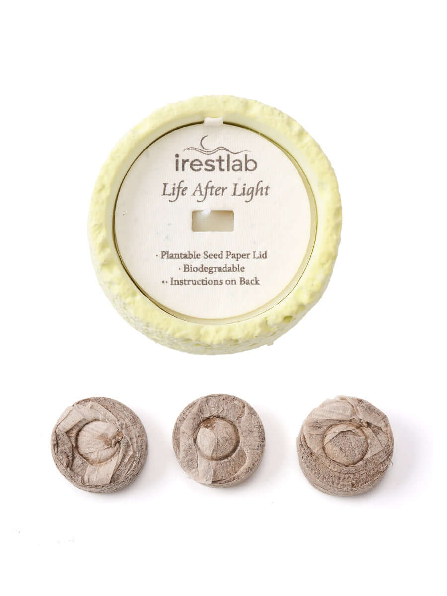 Seed candle by irestlab with biodegradable plantable lid and seed paper, promoting sustainability and inner peace.